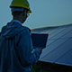 Engineer working with a laptop in solar power station